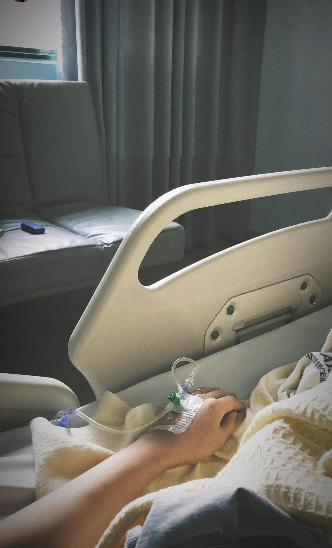 Holding a loved one's hand in a hospital bed